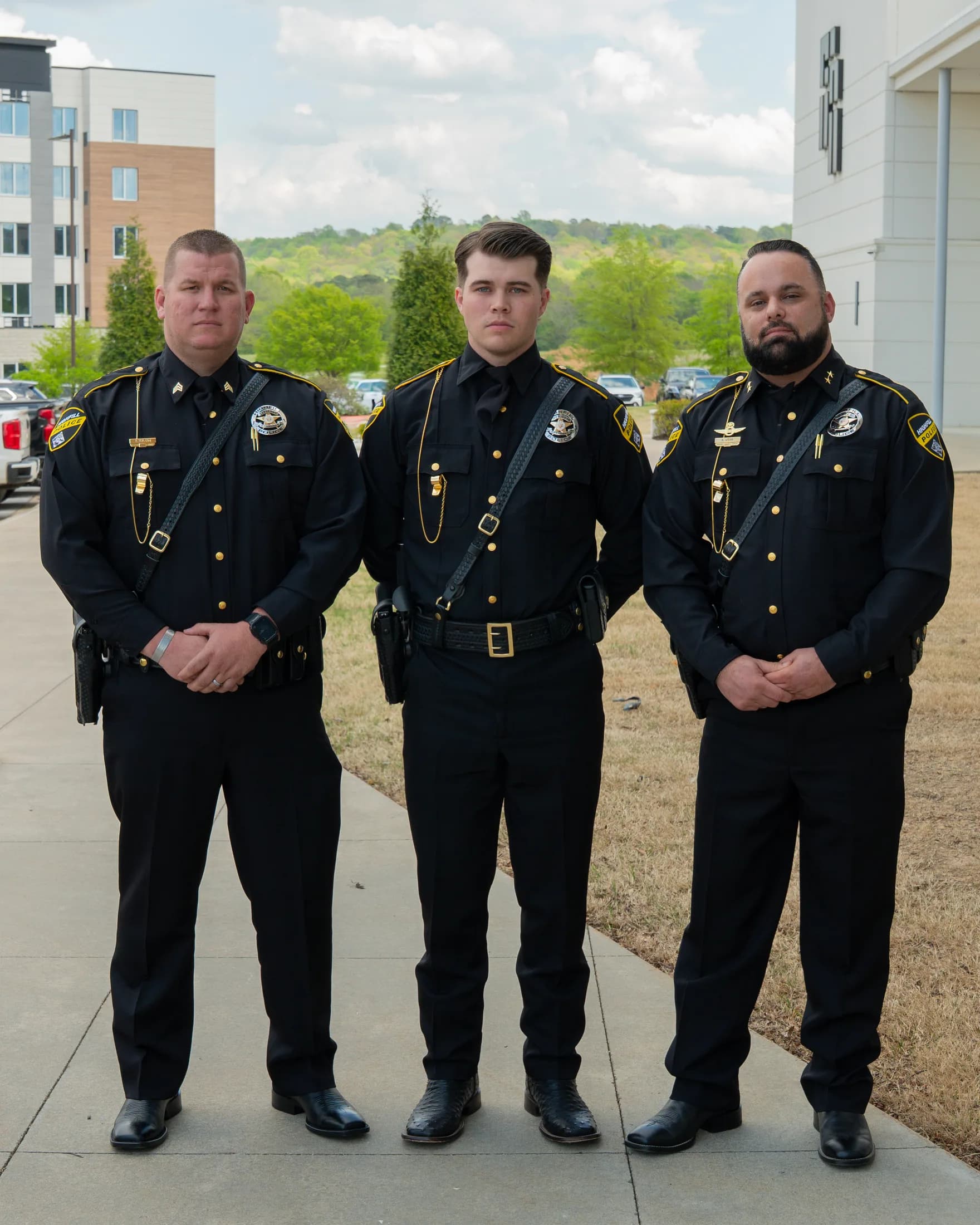 Highfill Police Department officers in dress uniforms after graduation